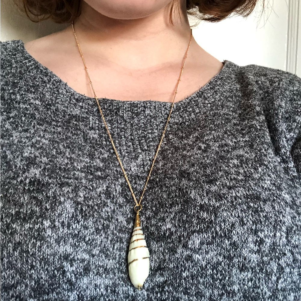 White Shell Pendant on a gold chain